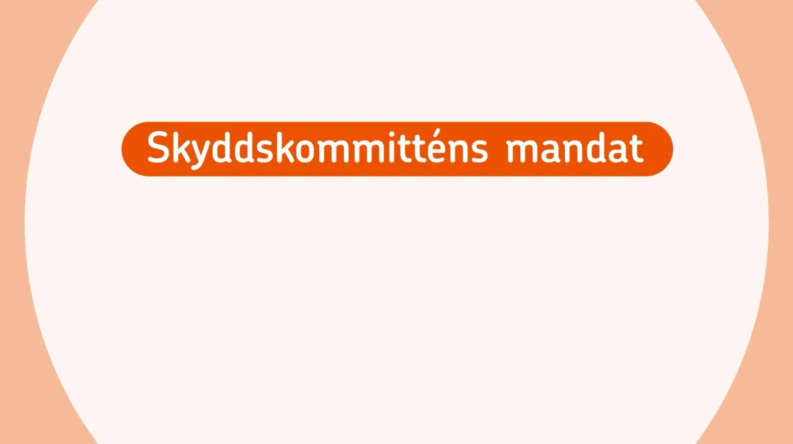 En orange och vit skylt med texten skydskommittens mandat.